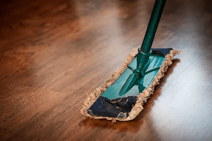 Cleaning mop on wood floor